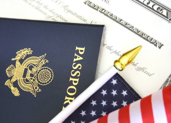 Certificate of Naturalization, U.S. Passport and American Flag