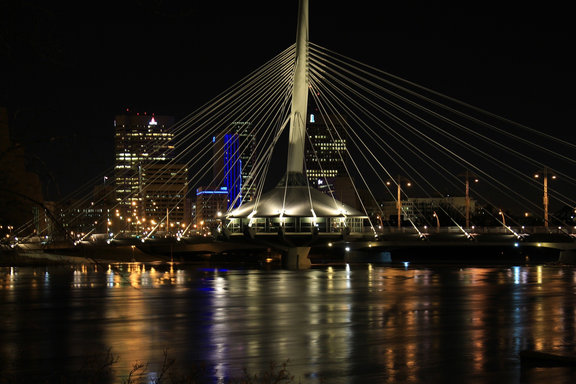 A view of the Provencher Bridge and Winnipeg skyline at night