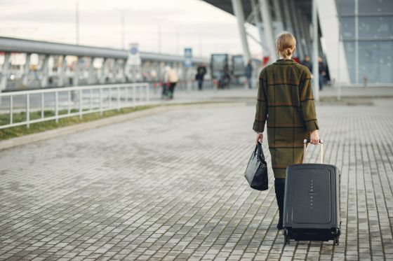 A business woman approaching a Canadian airport