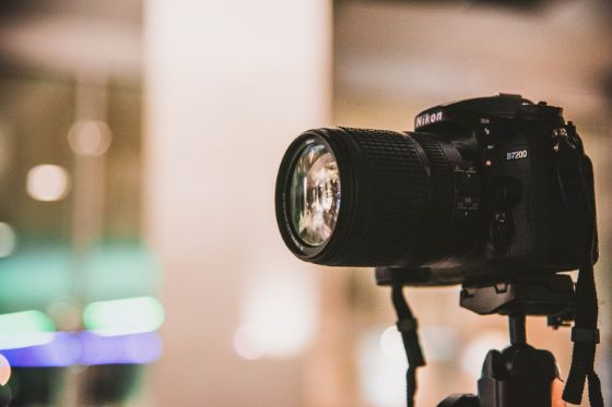 A camera on a tripod ready to take a passport photo