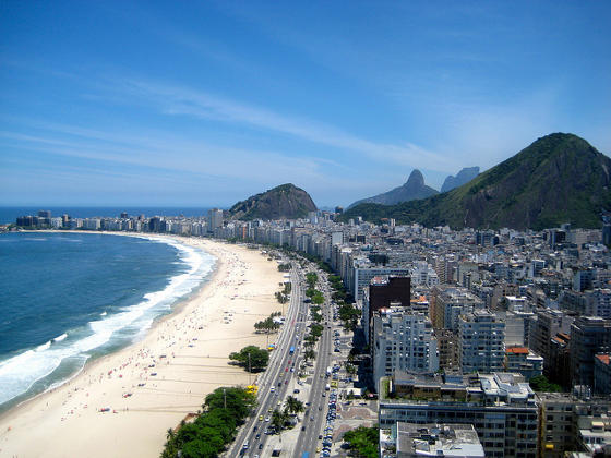 Copacabana beach in Rio de Janeiro with famous Sugarloaf mountain in background.