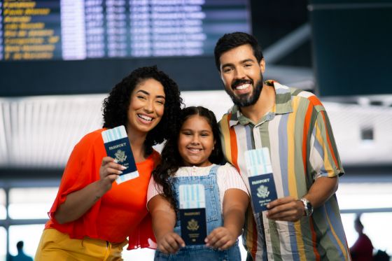 A family with passports at a Canadian airport terminal