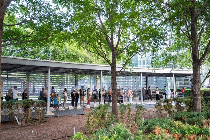 Long line of US citizens waiting to expedite passport at the Houston Passport Agency.