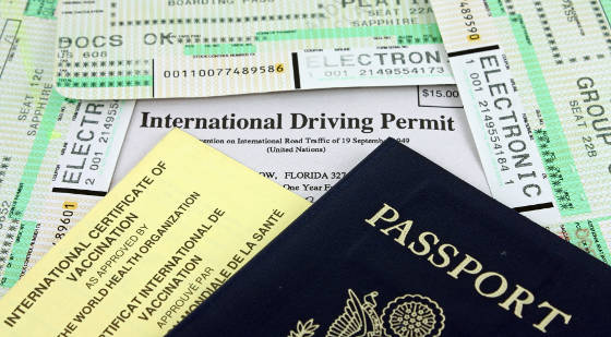 IMportant travel documents including a U.S. passport, immunization card, boarding pass and international drivers license