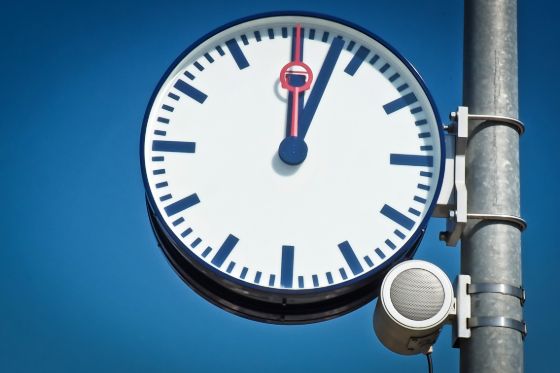 an analog clock outdoors