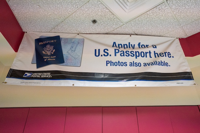 banner at a USPS offering passport photos.