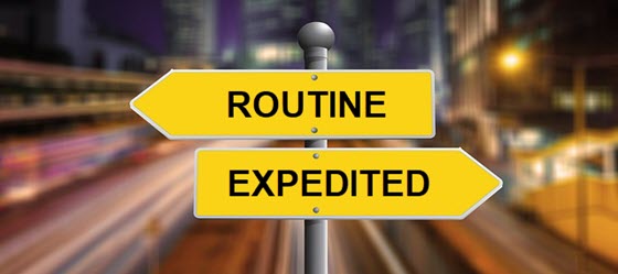 two signs that read "routine and expedited"
