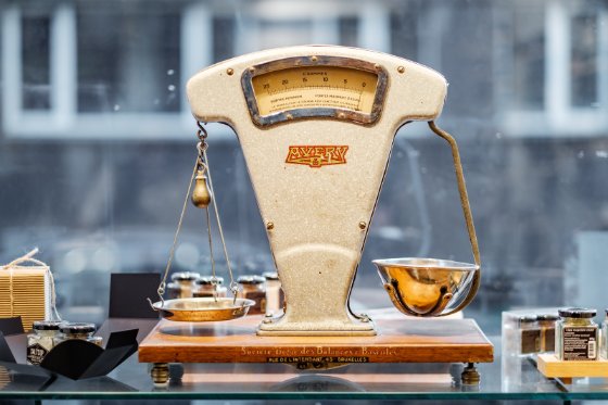 old fashioned balance scale in a shop window
