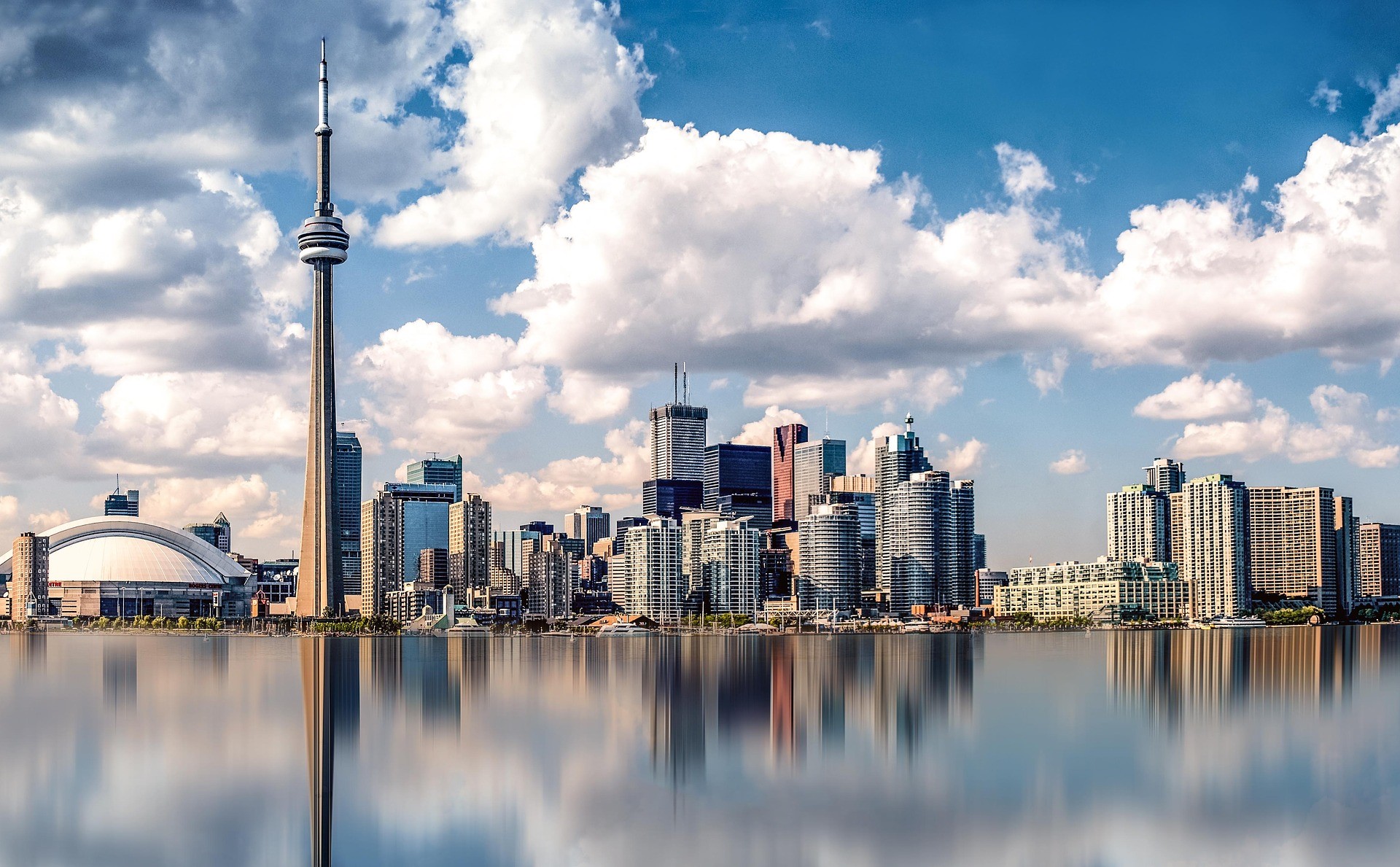 a daytime view of the Toronto, Ontario skyline from the harbor