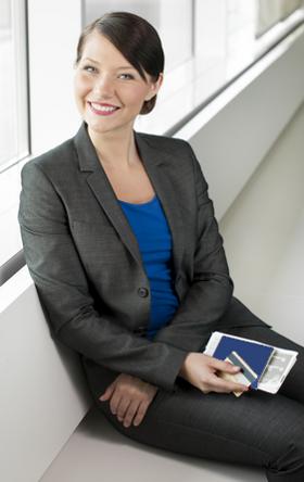 Traveling businesswoman with passport in hand