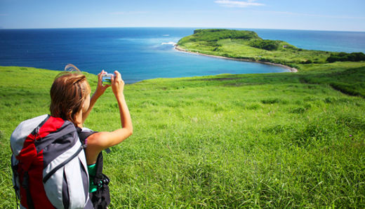Young woman traveler taking pictures