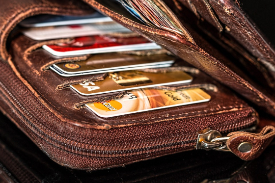 a leather wallet with seeral credit cards inside