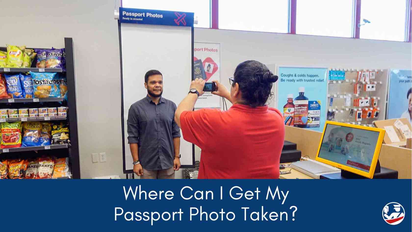 Young man gets a passport photo taken at a local store.