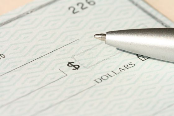 writing a check for passport fees payment