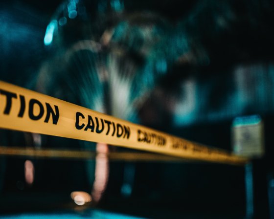 caution tape across a night scene