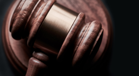 gavel resting on a black background