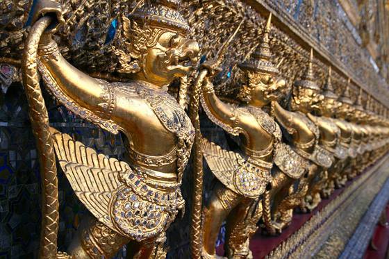 A row of gold sculptures at Bangkok's Royal Palace