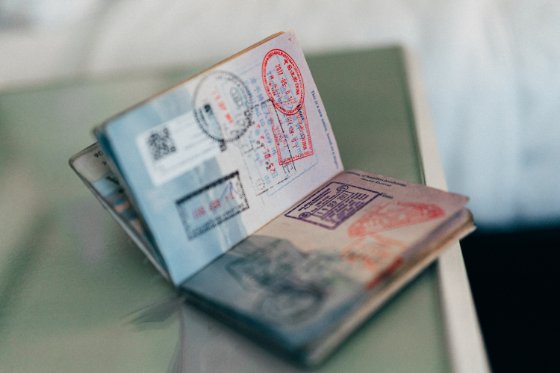 open US passport book with stamped pages