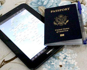 United States Passport, Samsung tablet and pen on table.