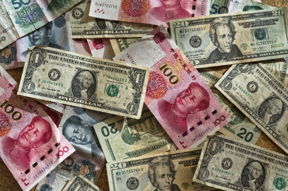pile of different types of currency